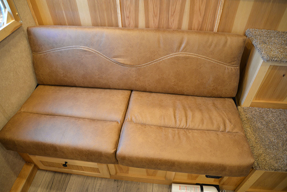 Sofa on Riser Wall in CX9SR Charger Edition Horse Trailer | Lakota Trailers
