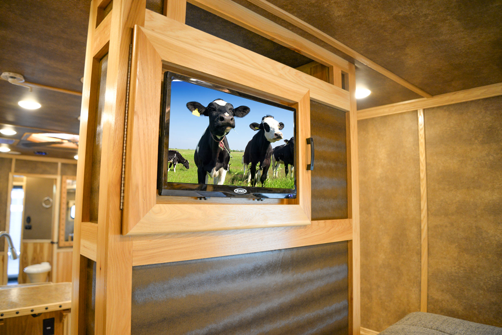 Bedroom TV in a BLE8X18CE Bighorn Edition Livestock Trailer | Lakota Trailers