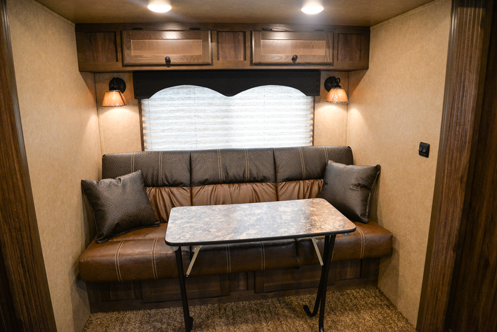 Sofa and Table in a C8X11 Charger Edition Horse Trailer | Lakota Trailers