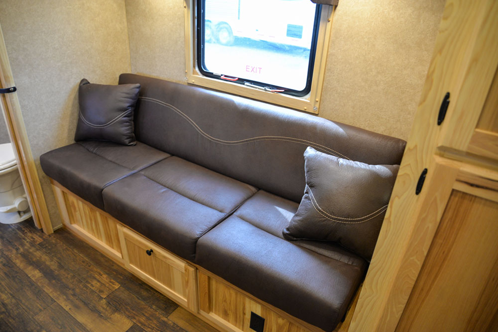 Sofa in a C8XHSLBP12SE Charger Bumper Pull Horse Trailer | Lakota Trailers