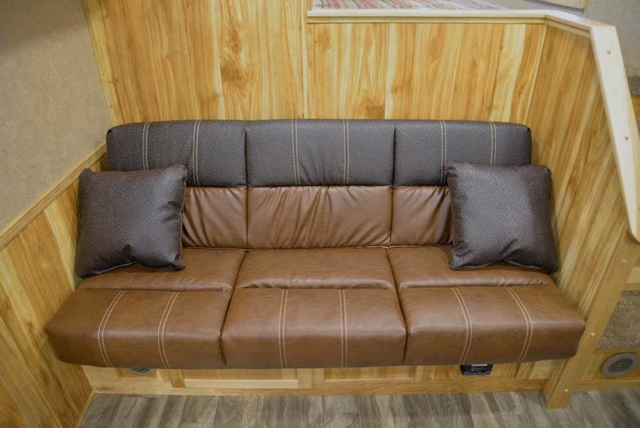 Sofa on Riser in C8X15SRB Charger Edition Horse Trailer | Lakota Trailers